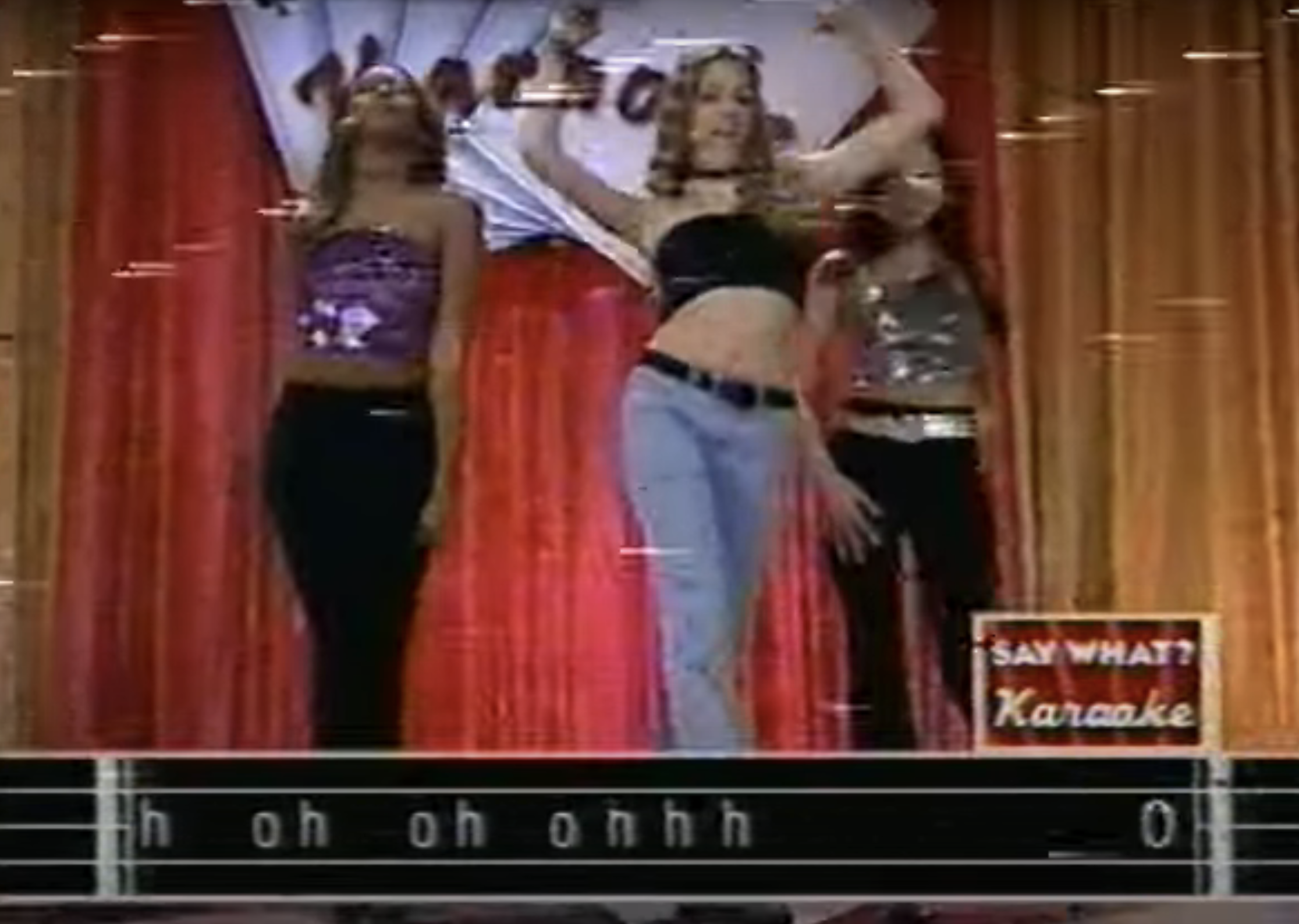three women performing on a stage on the show