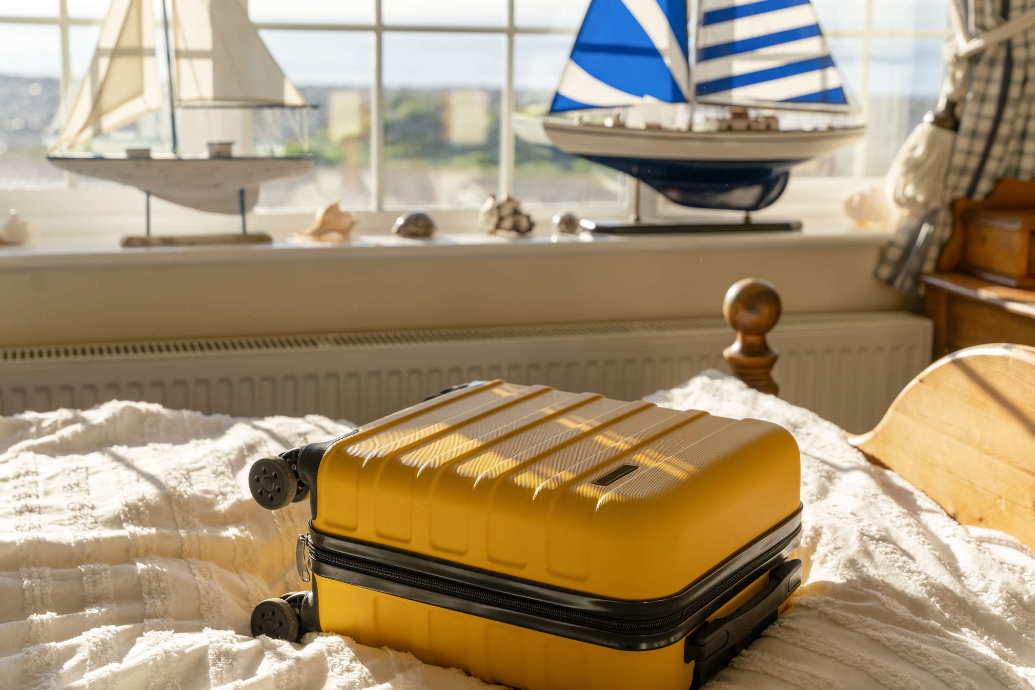A suitcase lying on top of a bed