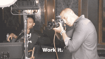 A photographer snaps a photo while saying &quot;work it&quot;