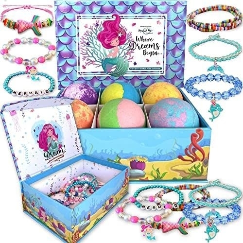 the mermaid-themed bath bomb set with colorful bath bombs and blue and pink bracelets
