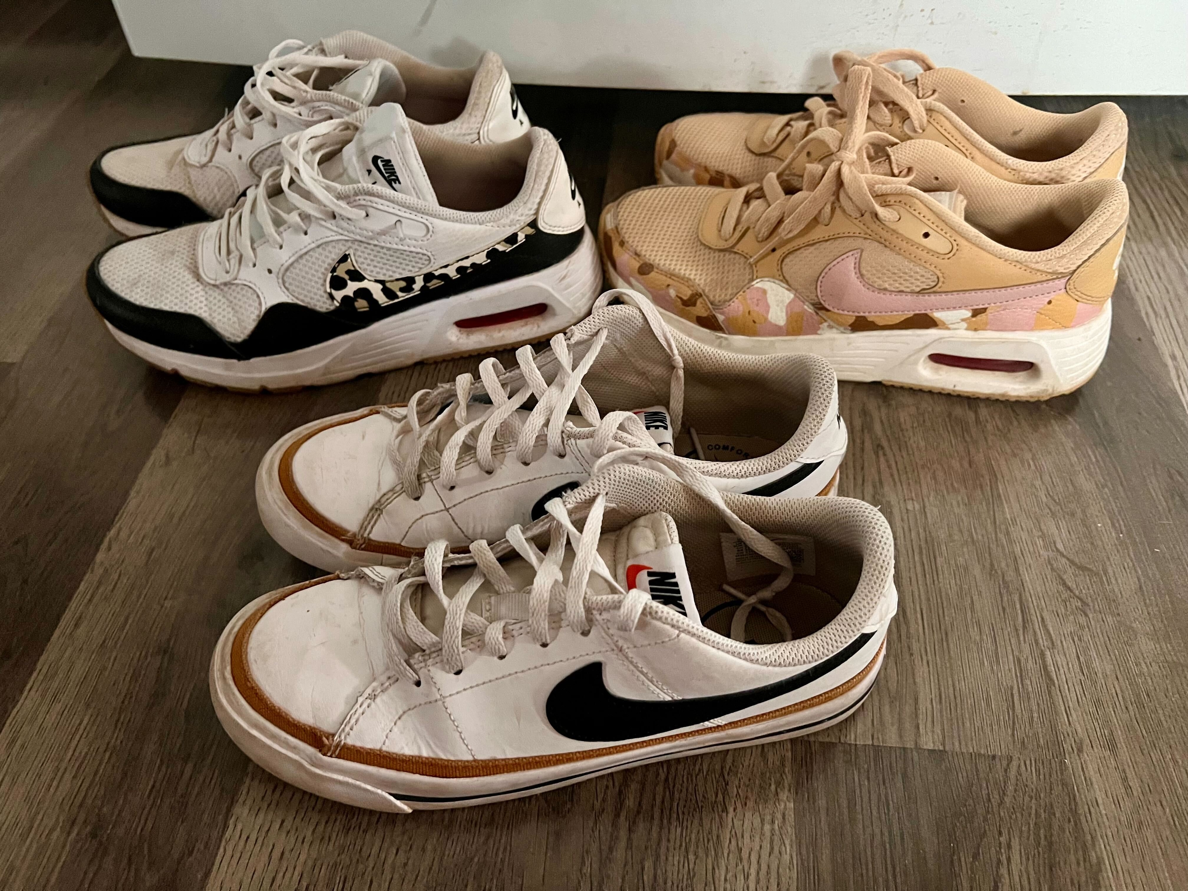 Three pairs of Nike sneakers