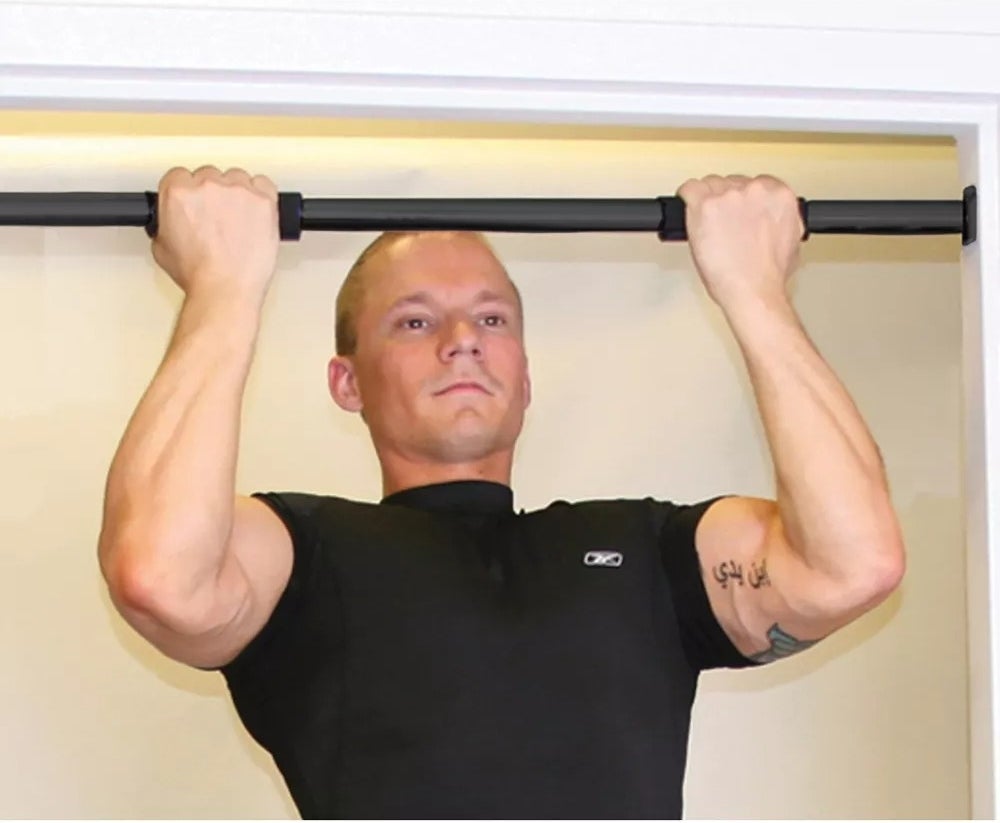 a model using the chin up bar