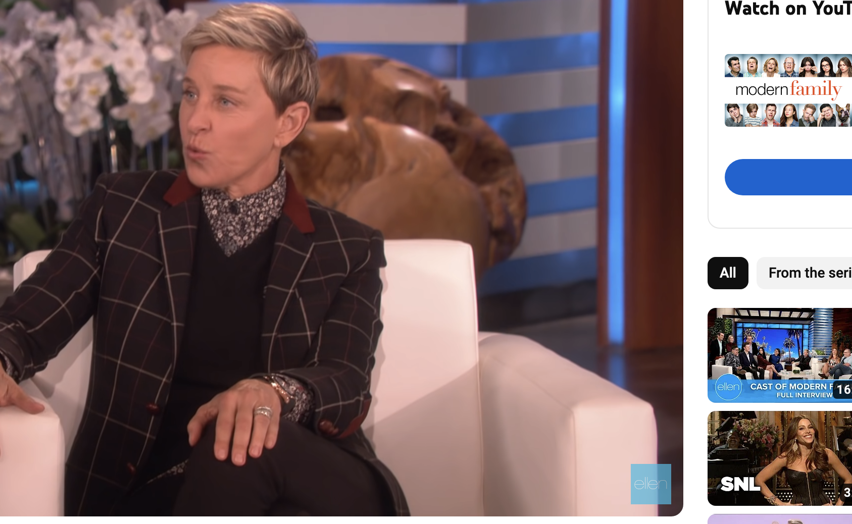 Close-up of Ellen sitting on her talk show