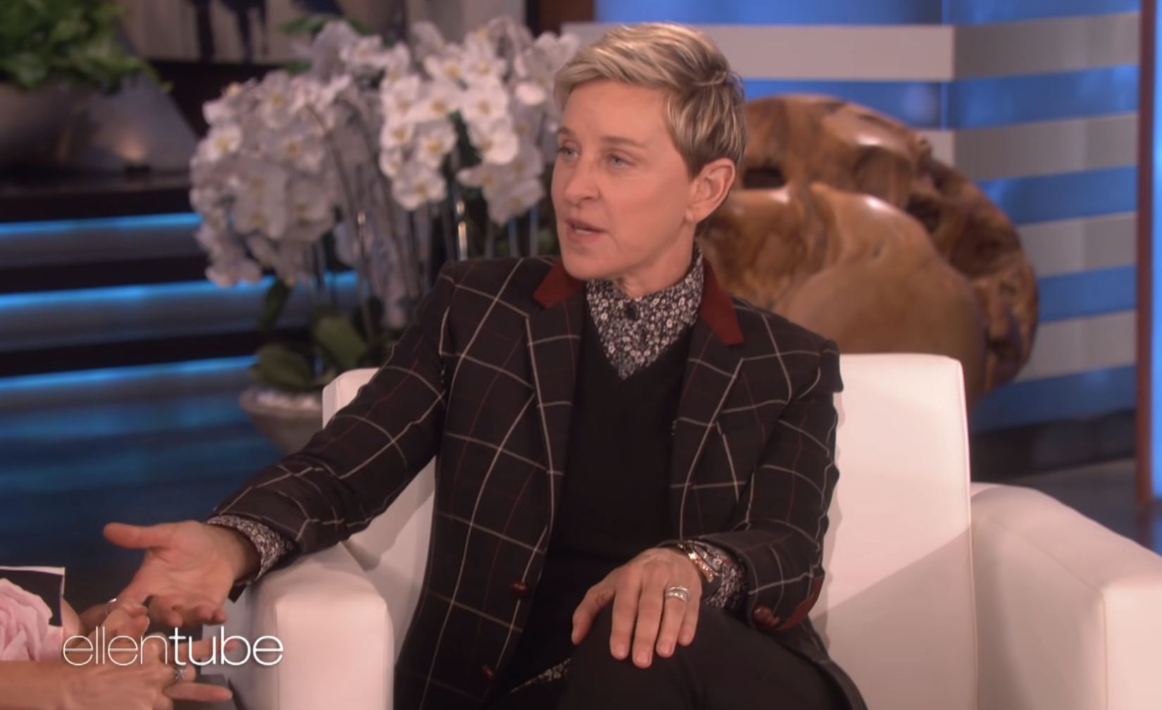 Close-up of Ellen sitting on her talk show