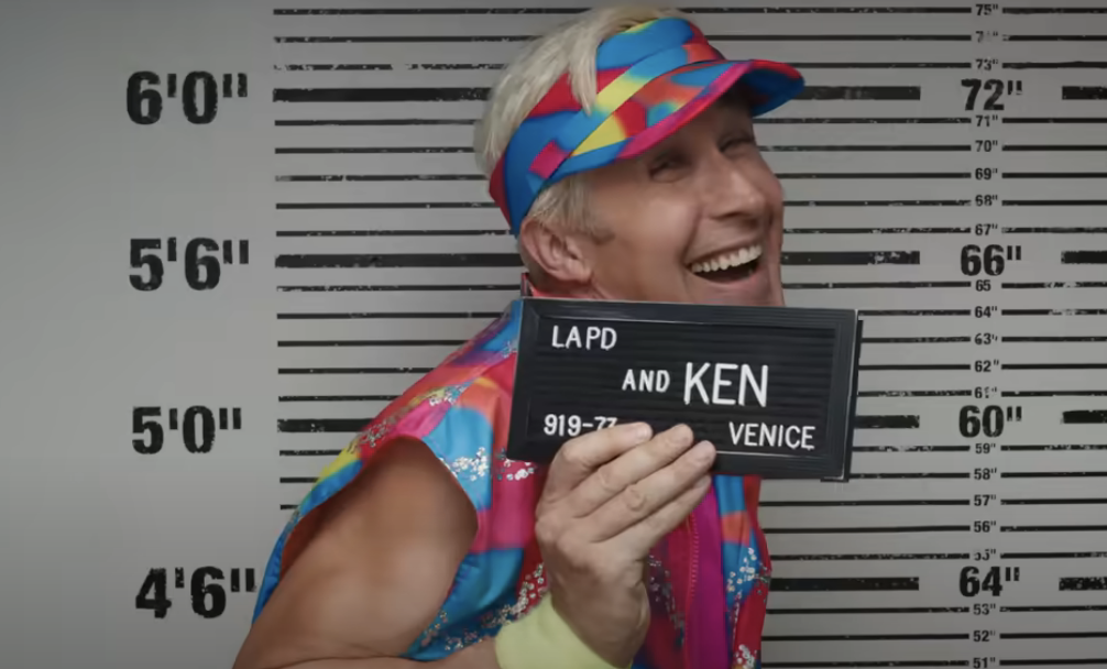 Close-up of Ryan as Ken in a mugshot in the movie