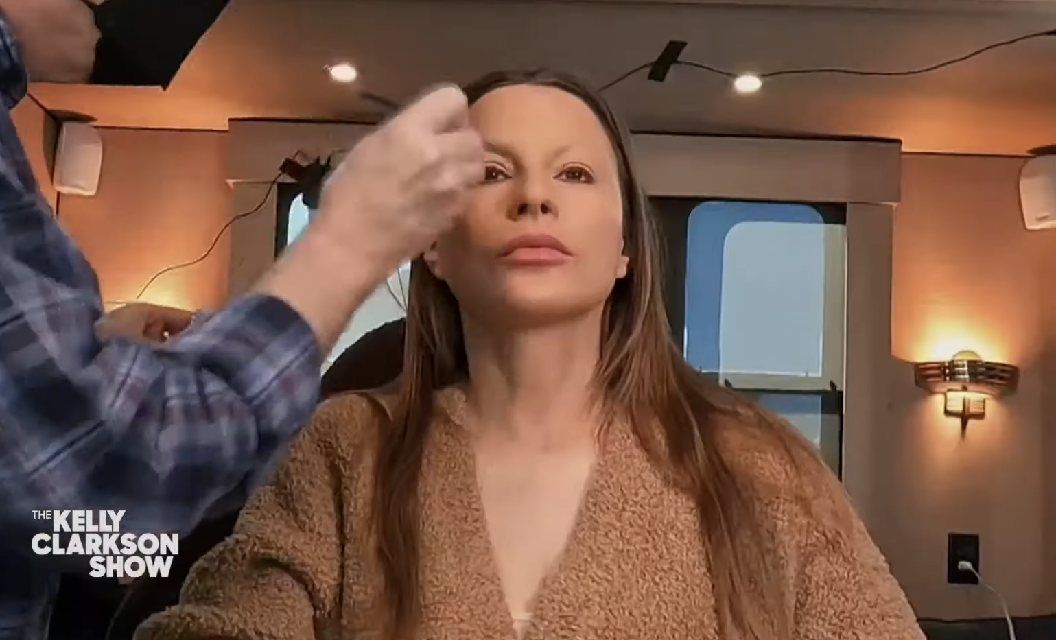 Close-up of Sofía having makeup applied to her face