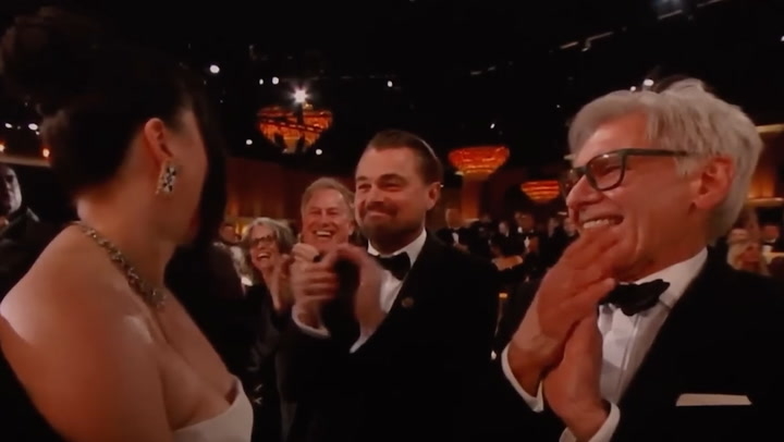 Lily Gladsone, Leonardo DiCaprio, and Harrison Ford at the Golden Globes