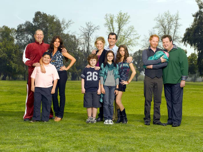 The cast of &quot;Modern Family&quot; standing outside in the grass