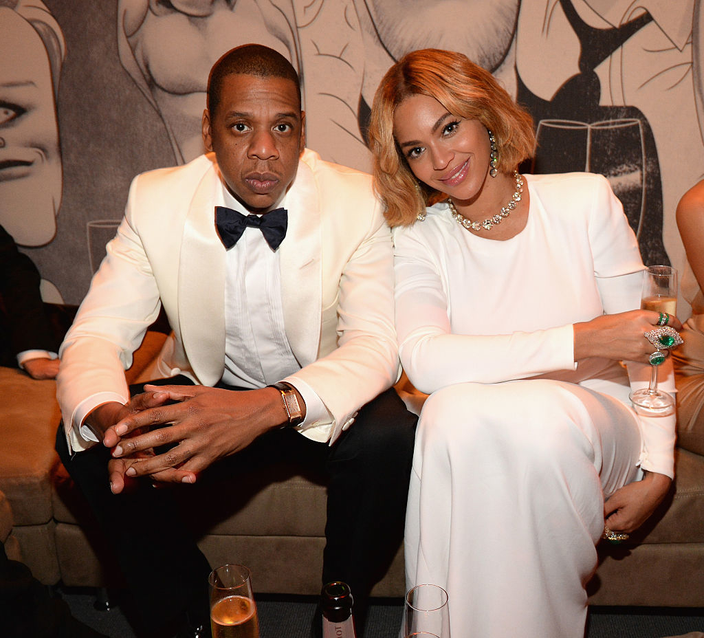 beyonce and jay-z sitting and drinking champagne