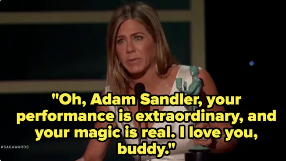 on stage she says, adam sandler, your performance is extraordinary and your magic is real, i love you buddy