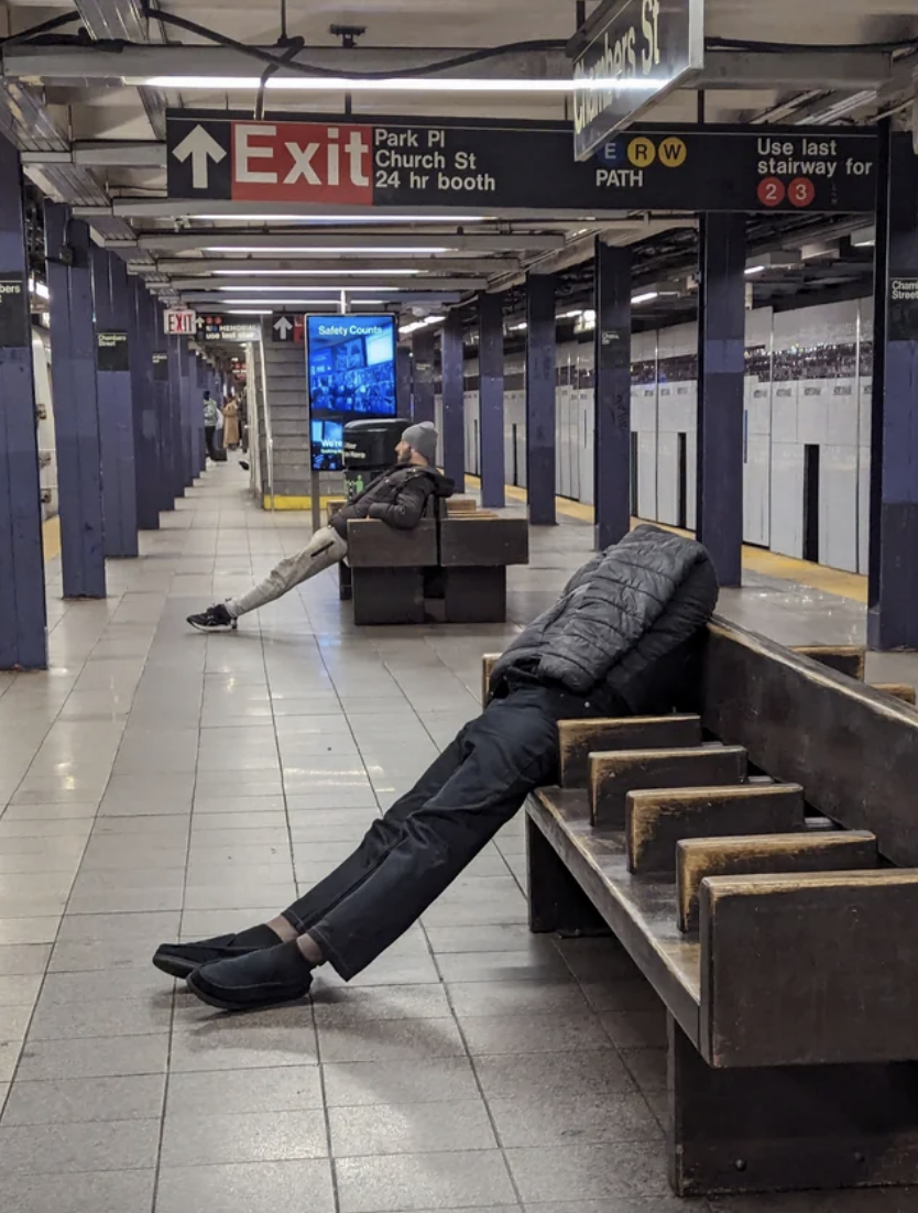 a person waiting for a train with no head