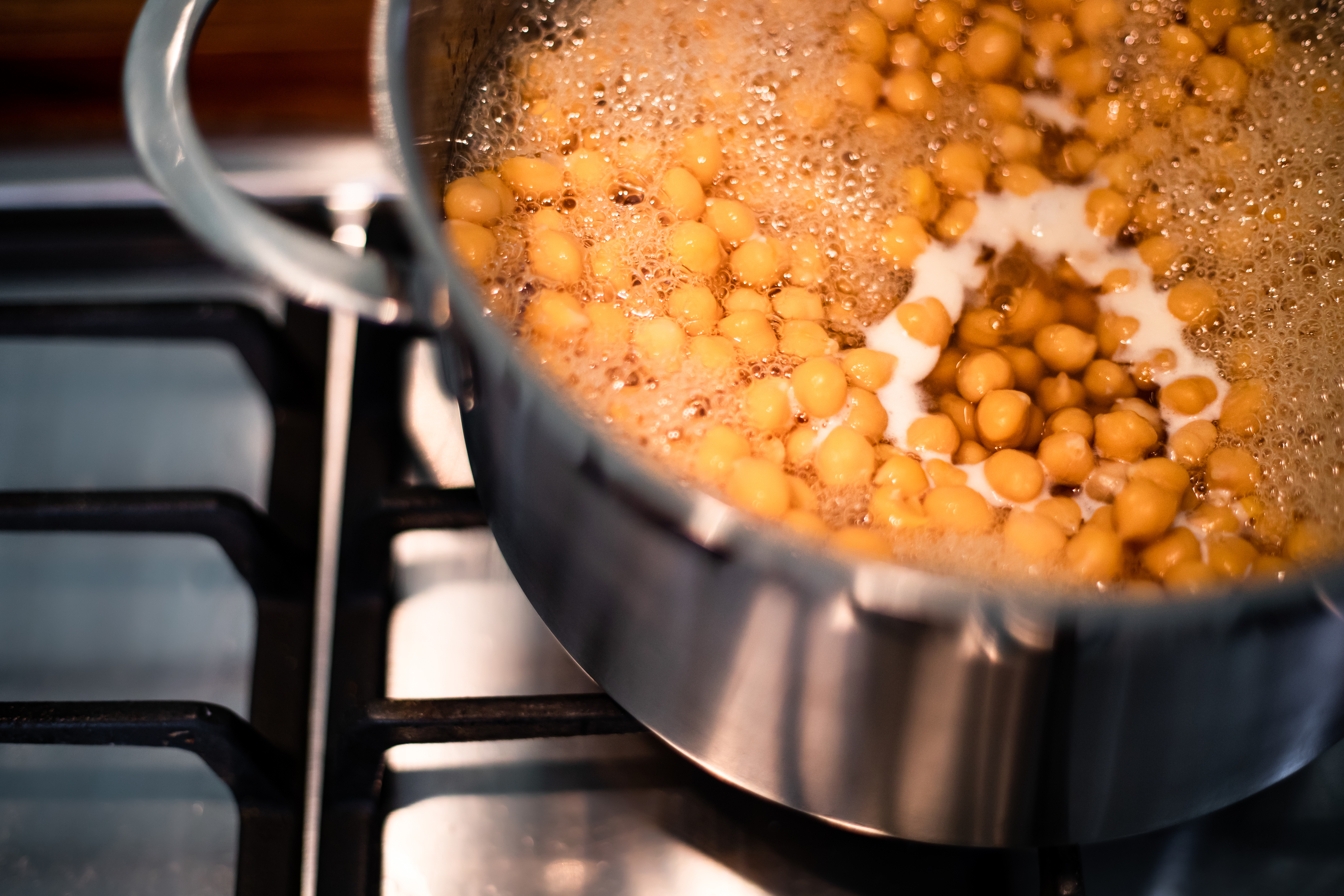 A pot of chickpeas simmering on the stove