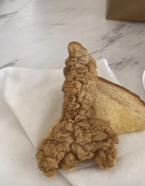 A fried chicken strip in the shape of a penis and scrotum