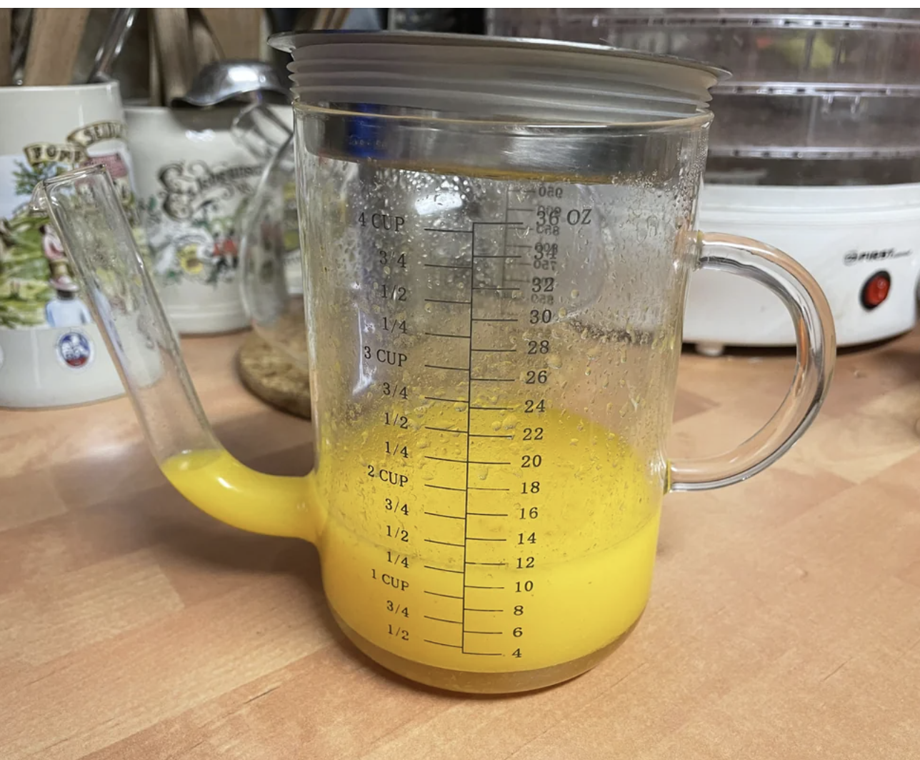 Orange liquid in a 4-cup measuring pitcher