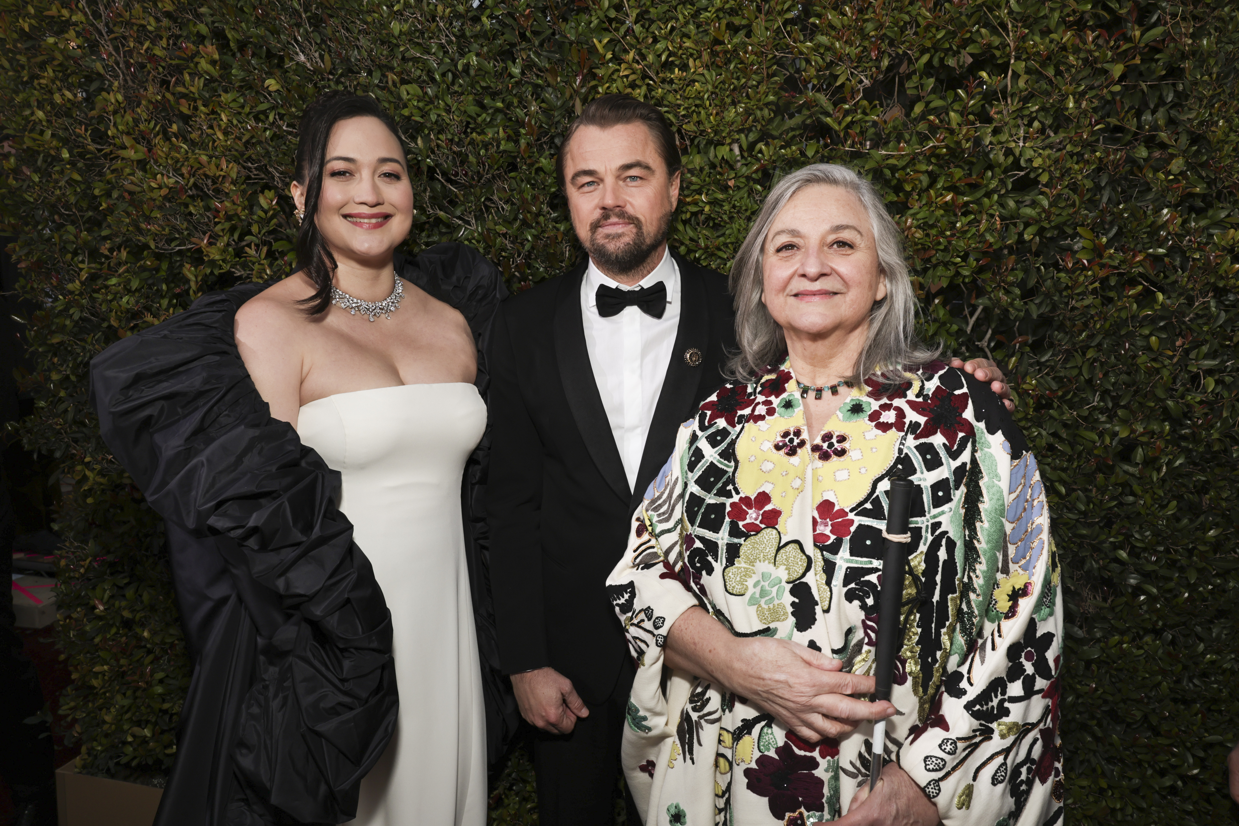 Lily with Leo and her mom on the red carpet