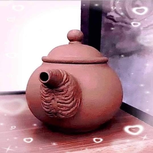 pottery teapot with balls