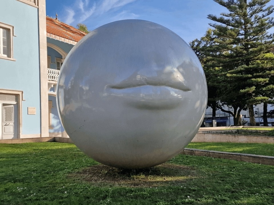 huge round sculpture with lips