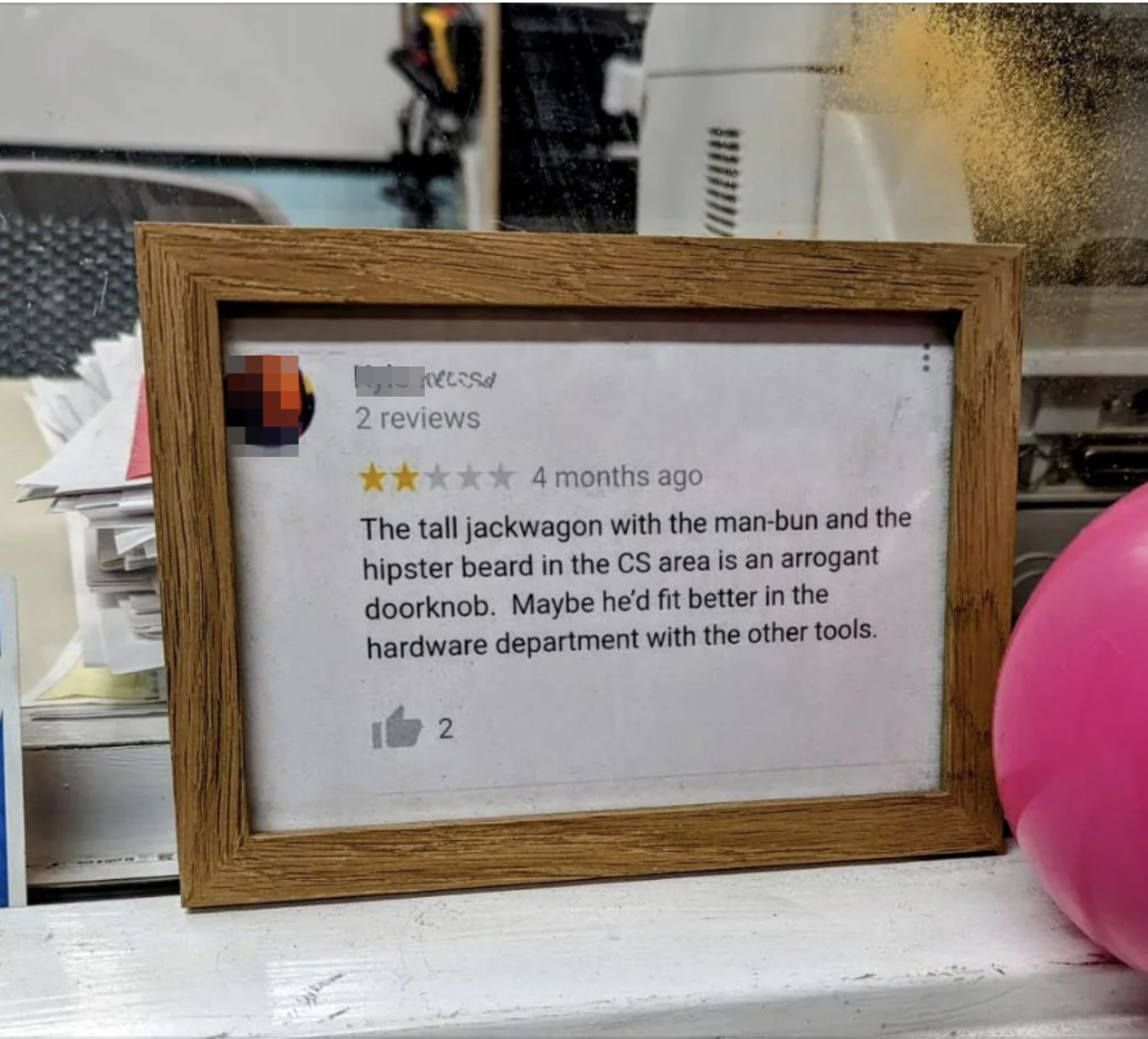 A framed Yelp review