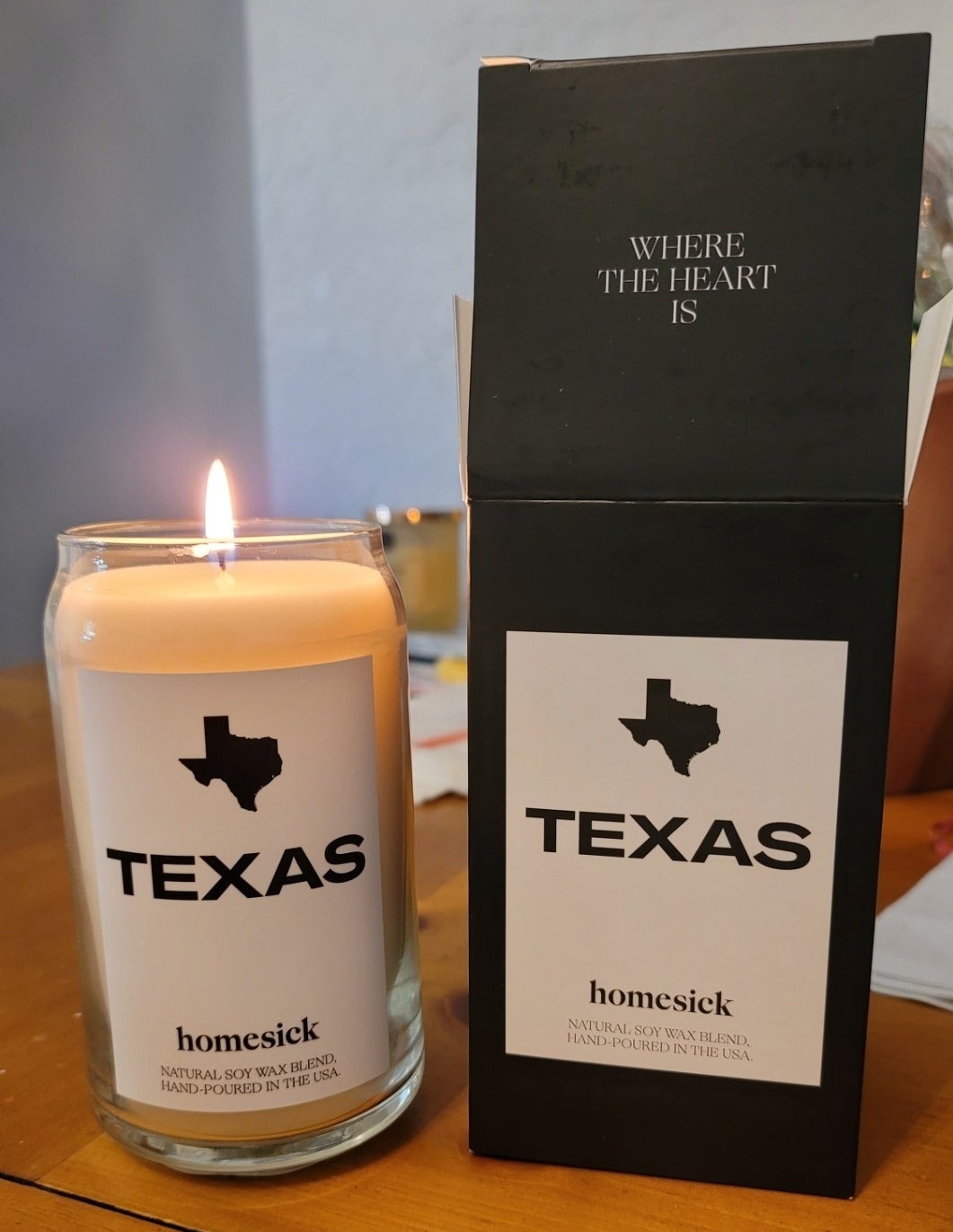 a reviewer photo of the texas candle and its packaging