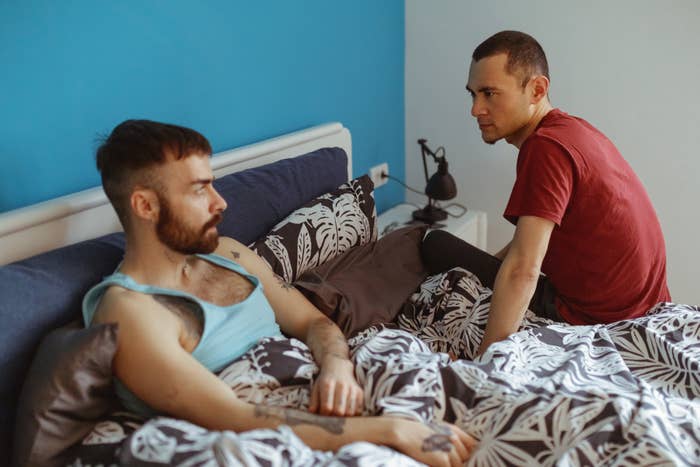 gay couple fighting in bed