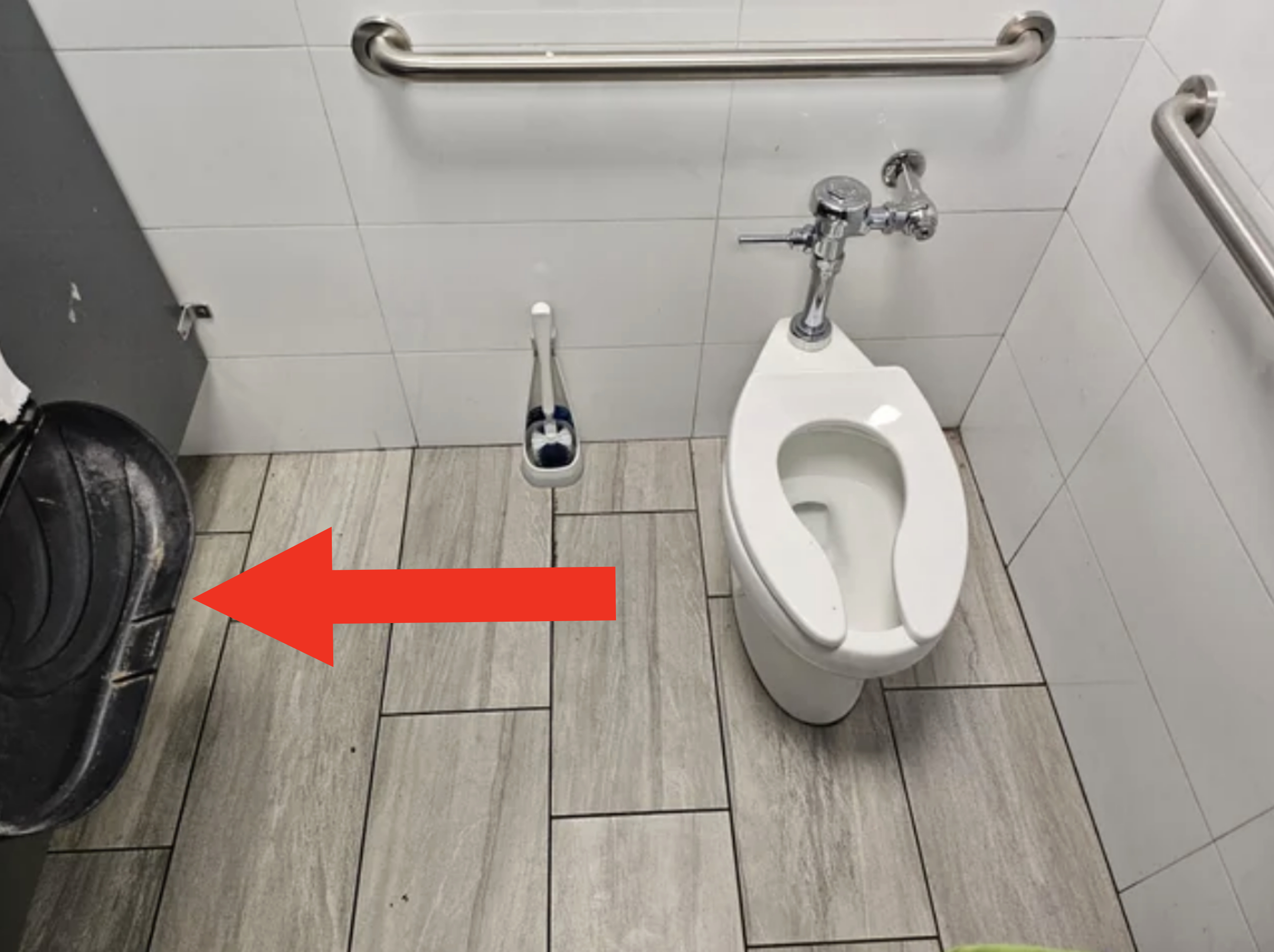 Overhead view of the distance between the toilet bowl and the dispenser