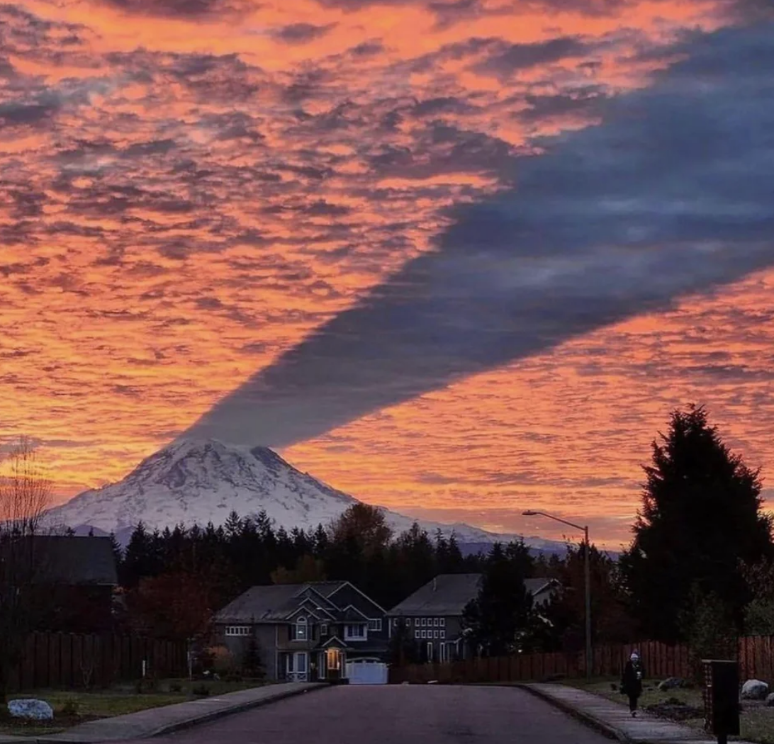 a mountain shadow across the sky