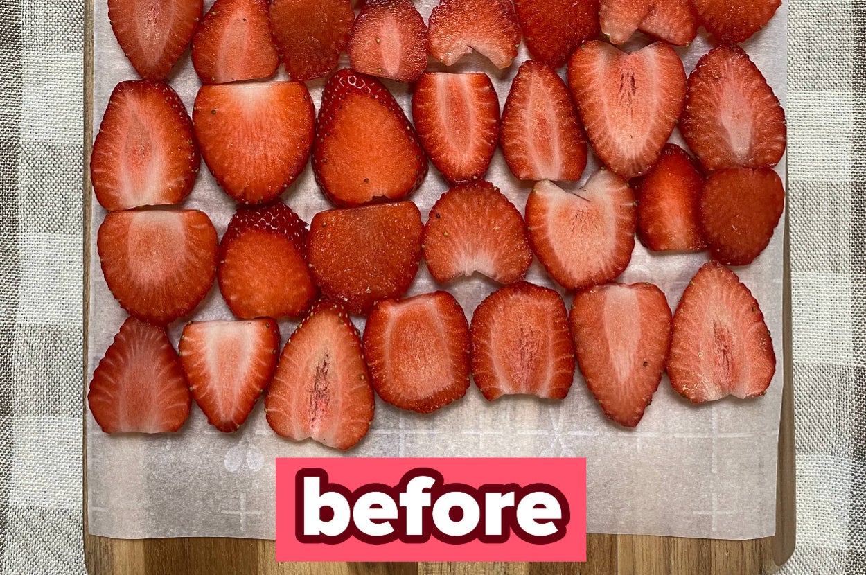 Sliced strawberries on a cutting board