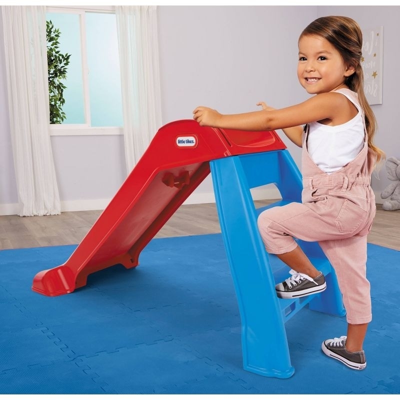 child climbs on a slide