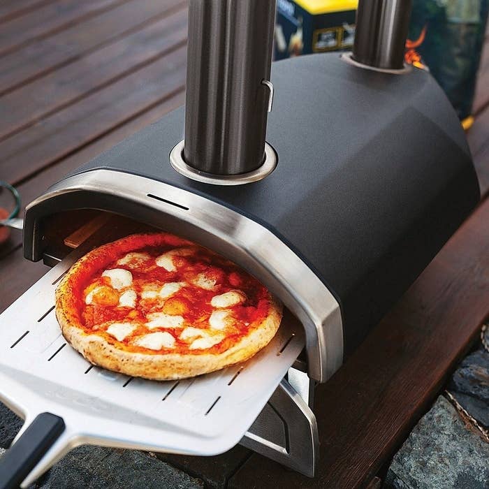 the pizza oven with a cheese pizza