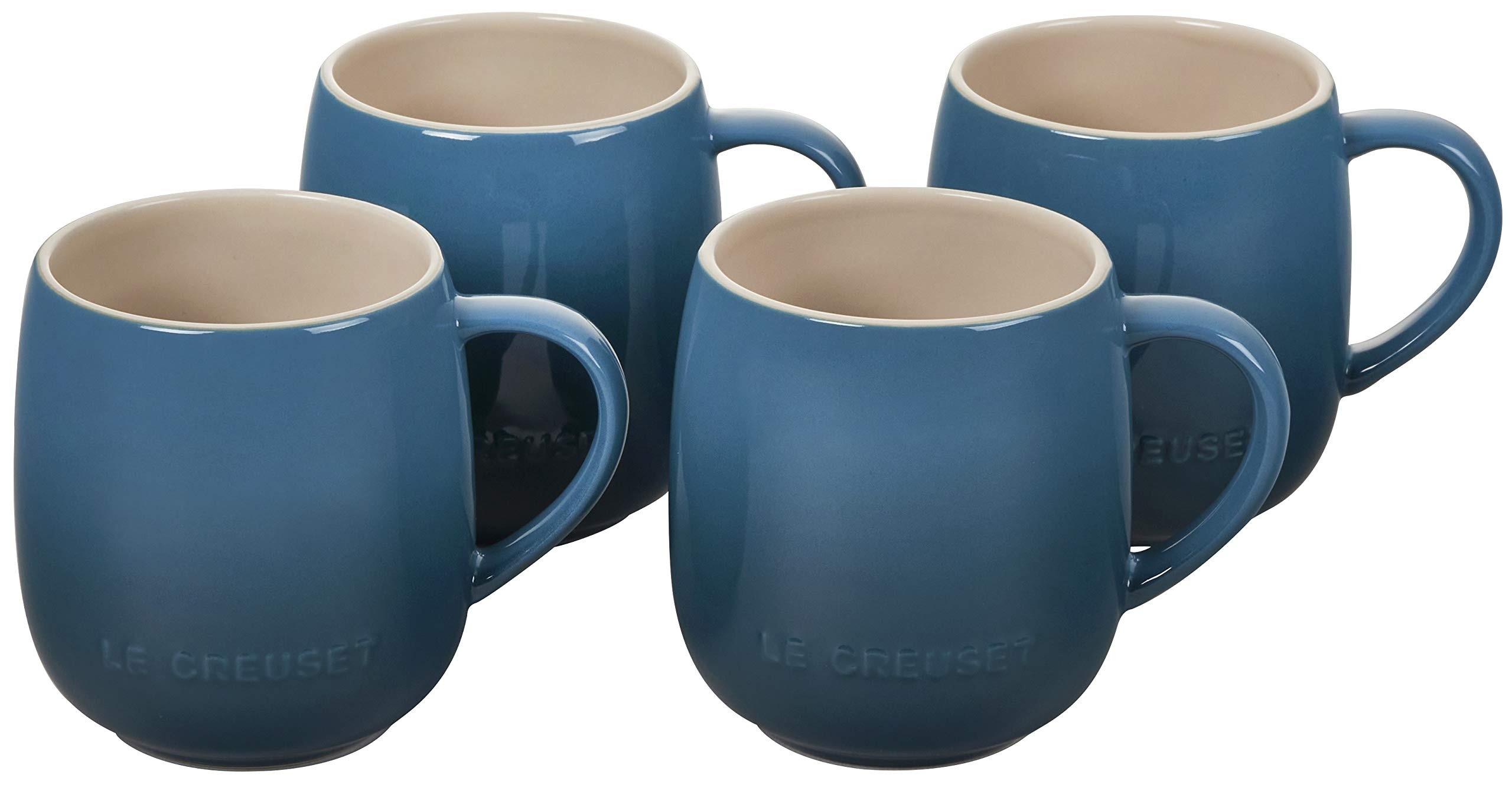 a set of four blue mugs