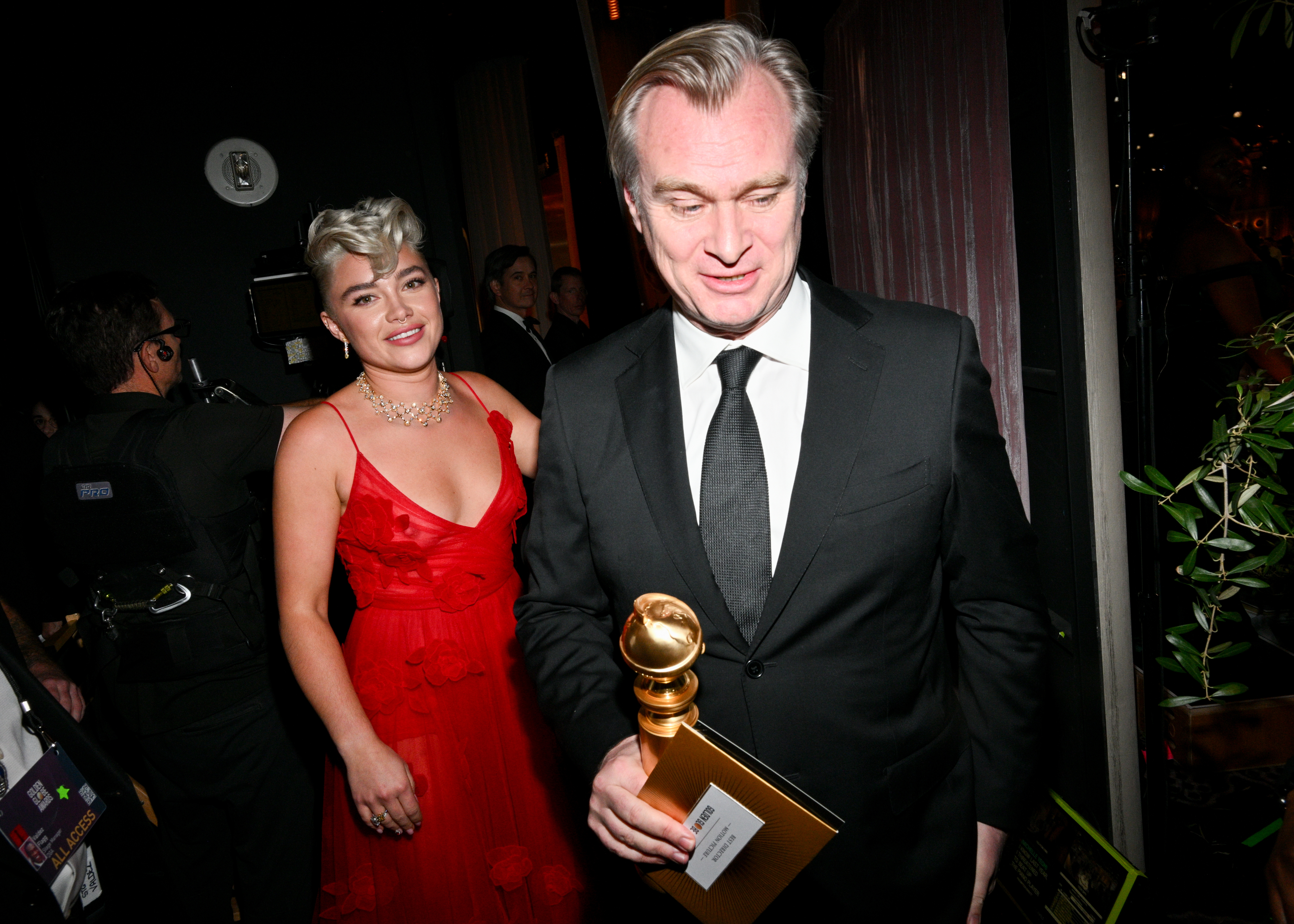 Close-up of Florence and Christopher, who&#x27;s holding a Golden Globe award