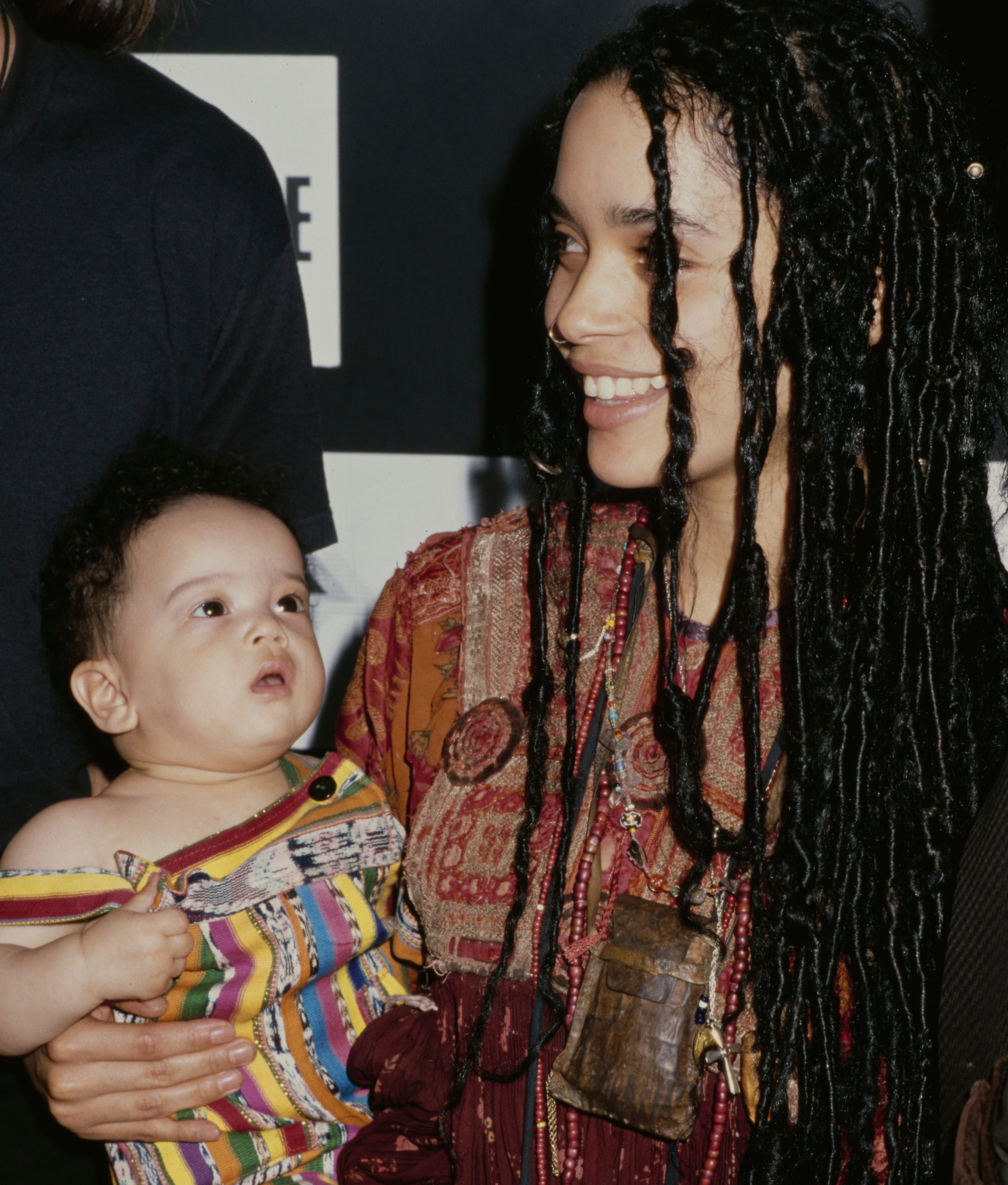 Close-up of Lisa with baby Zoë at a media event