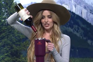 dakota johnson dumping a bottle of josh wine into a stanley cup