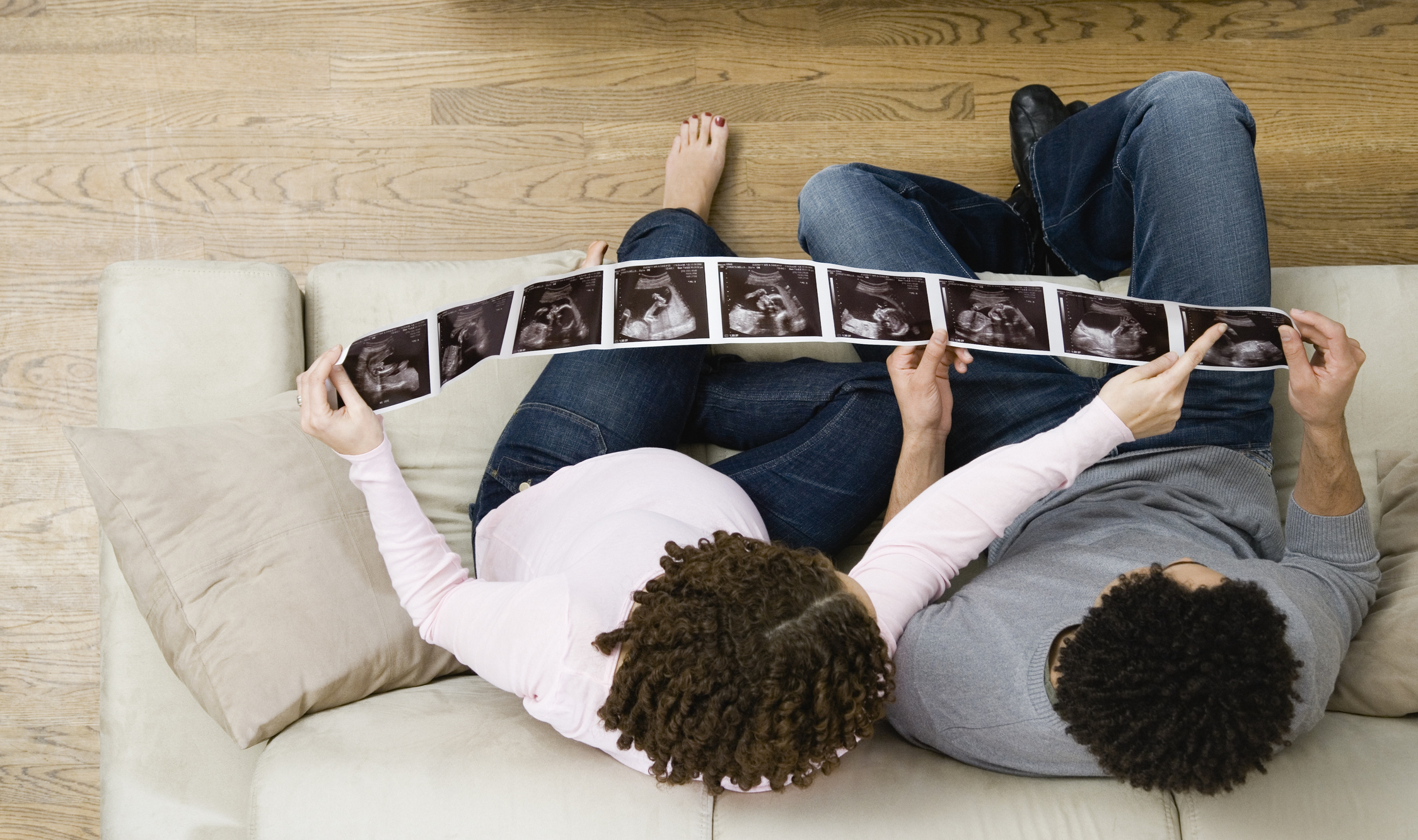 A couple looking at ultrasound photos