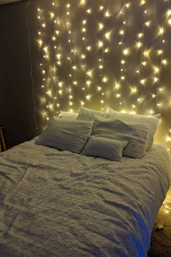 string lights above a bed