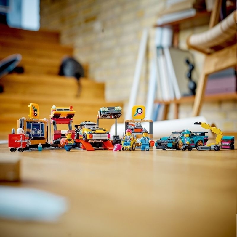 A built Lego set with Lego figures and cars