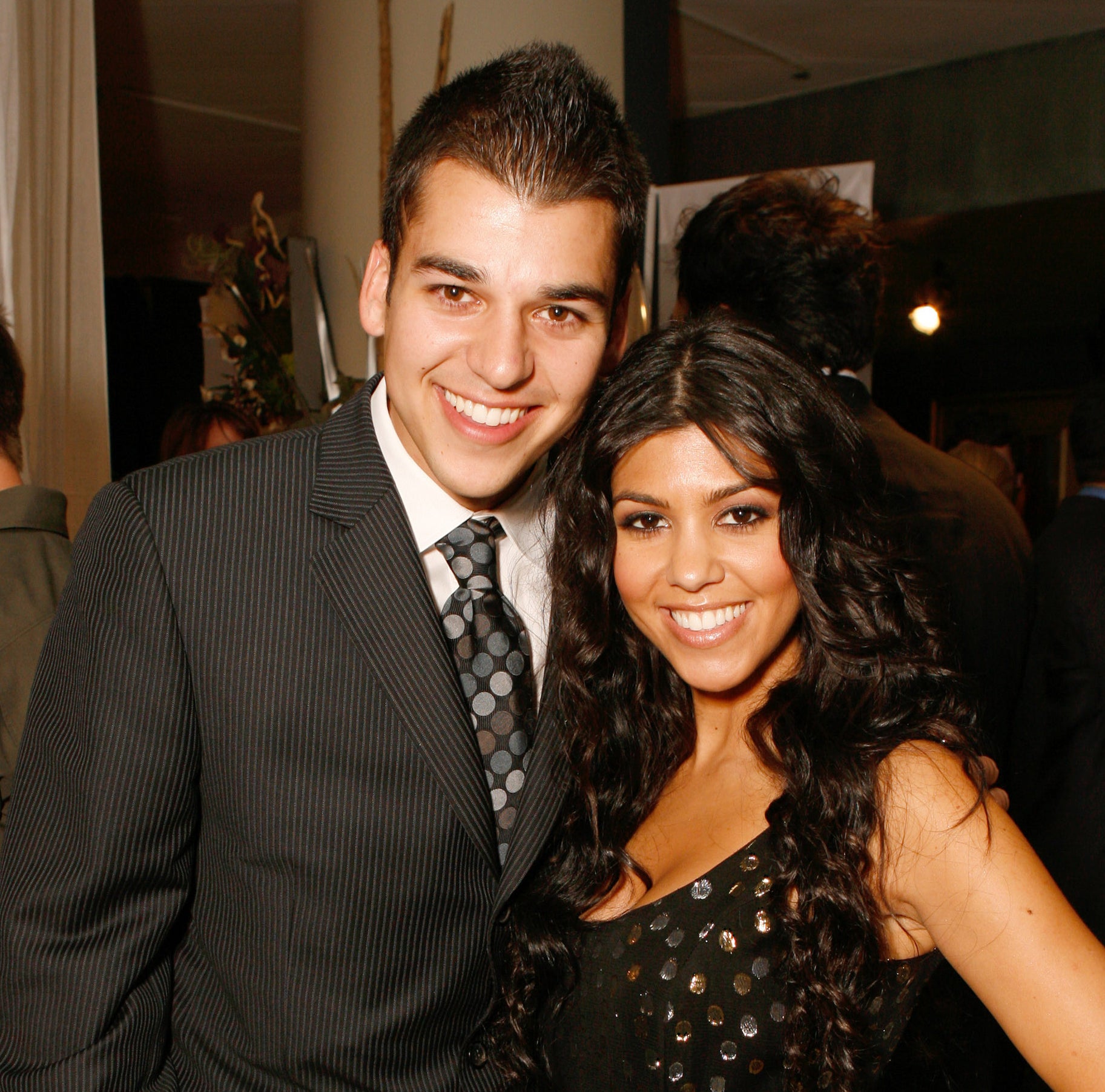 Rob and Kourtney smiling for a photo