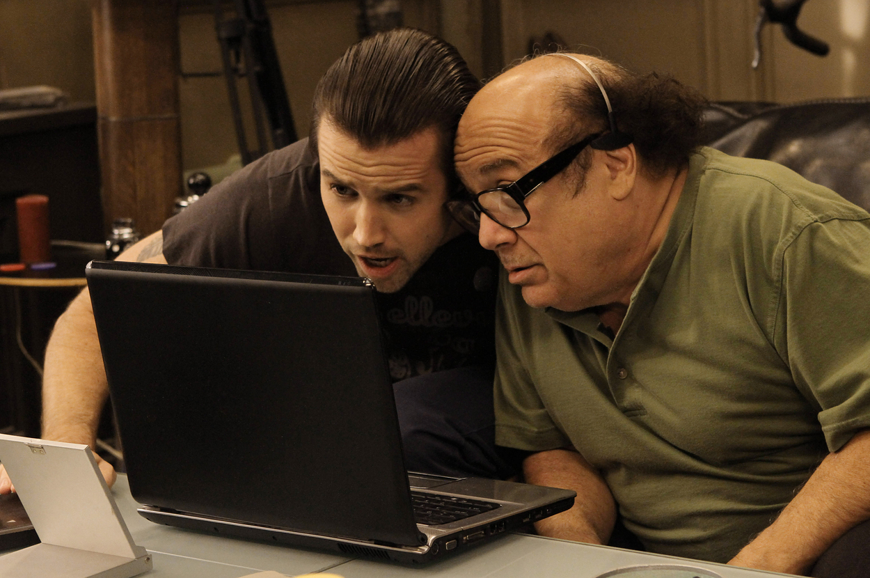 Mac and Frank looking at a laptop