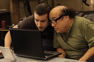 Mac and Frank looking at a laptop