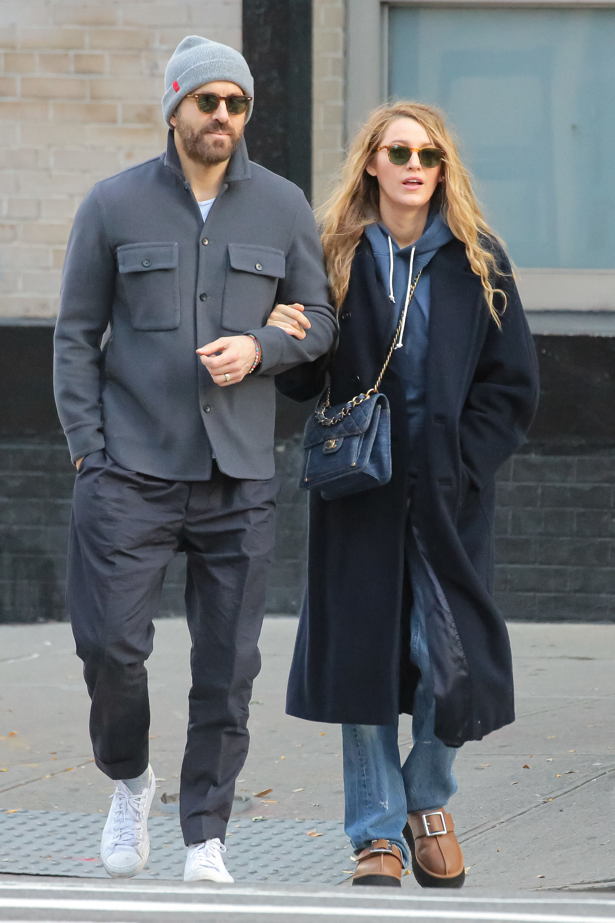 closeup of Ryan Reynolds and Blake Lively taking a stroll arm-in-arm