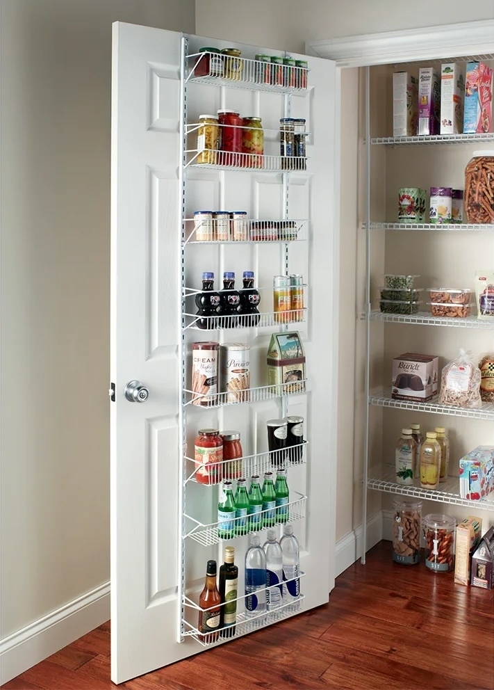 white metal door organizer holding food items in a pantry
