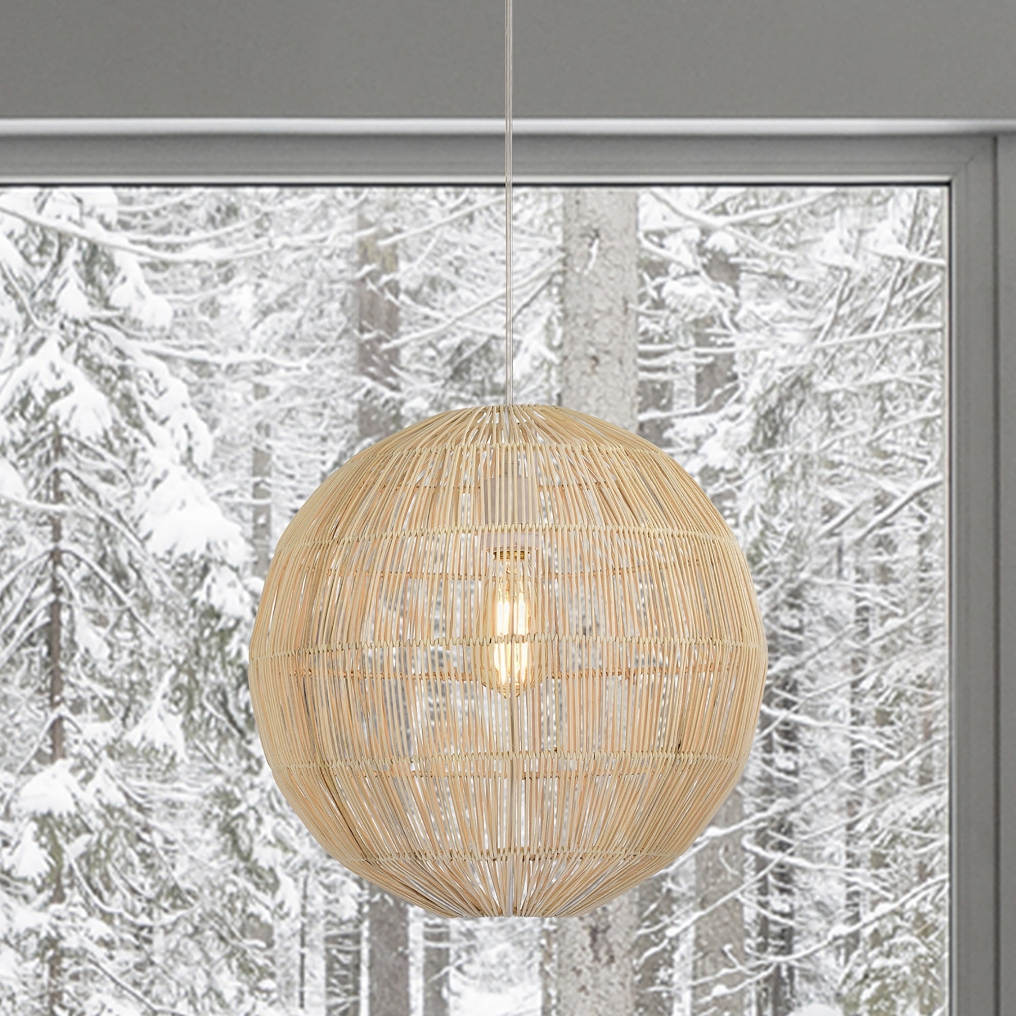 the globe pendant lamp in front of a snowy forest
