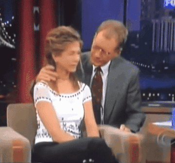 GIF of Letterman sneaking up on Jennifer Aniston
