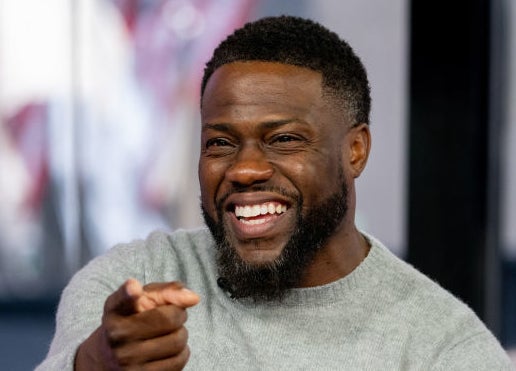 Closeup of Kevin Hart pointing and laughing