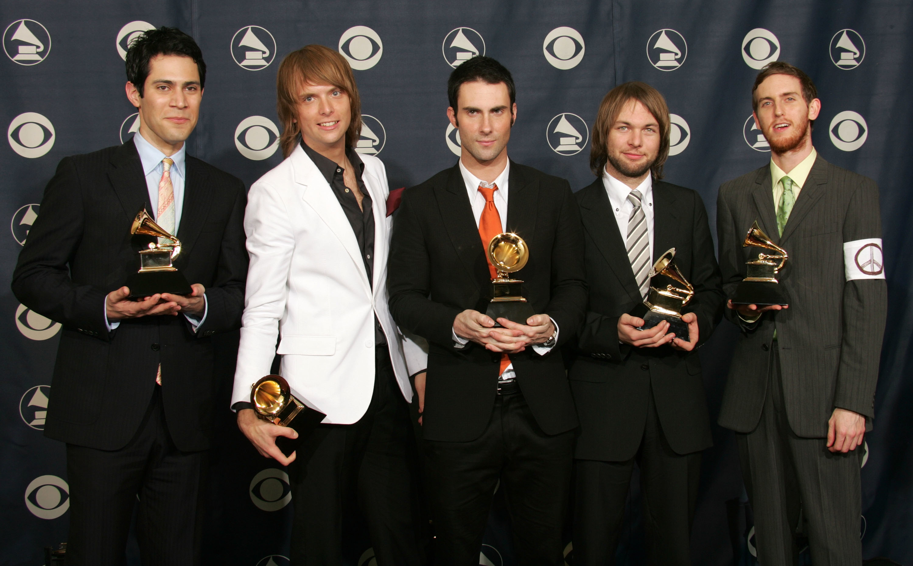 Maroon 5 holding their Grammys