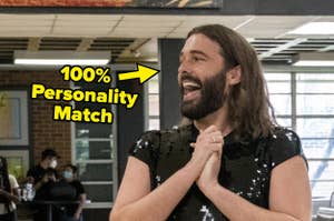 Jonathan Van Ness holding his hands together excitedly.