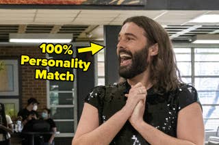 Jonathan Van Ness holding his hands together excitedly.
