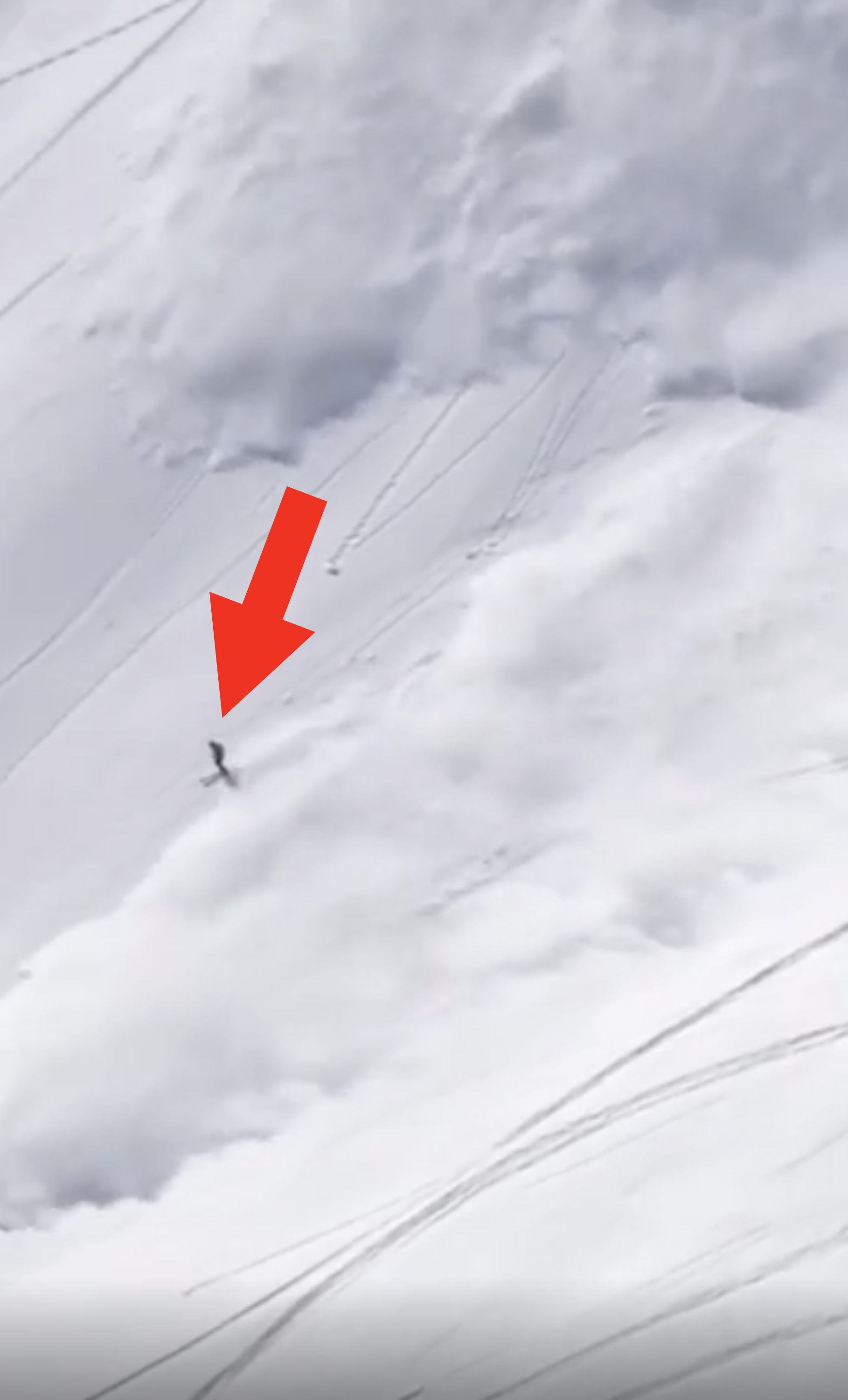 A skier outrunning an avalanche