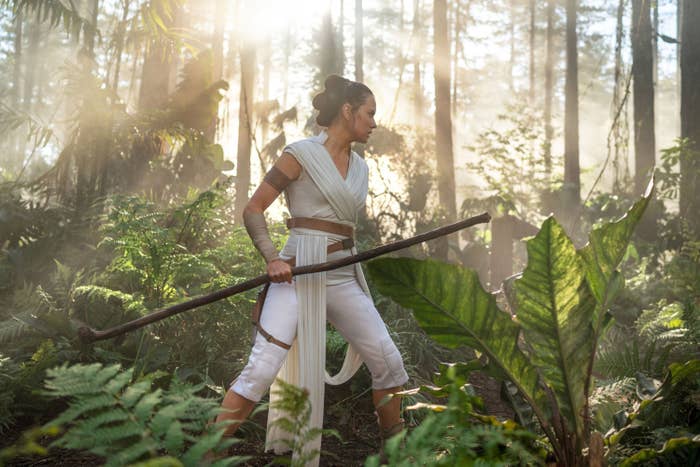 Daisy and Rey with a weapon in the woods