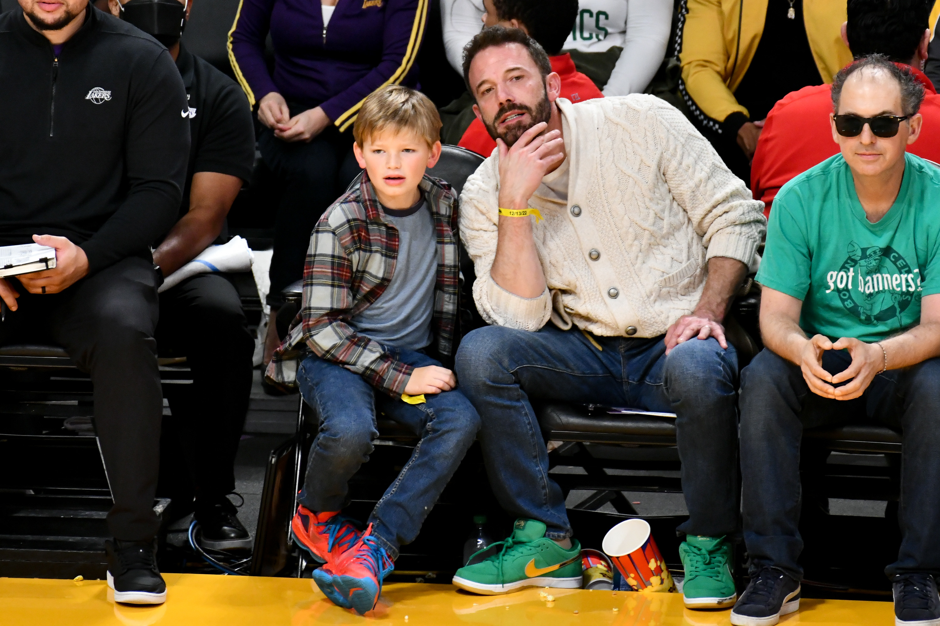 ben sitting courtside with his son
